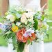 Natalia's wild, textured bouquet featured garden roses, astilbe, Queen Anne's lace, scabiosa and ranunculuses.