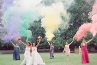 Jazmin and Jessica chose a vibrant rainbow color palette for their wedding the Tree of Life in Audubon Park in New Orleans, Louisiana. "Our love story