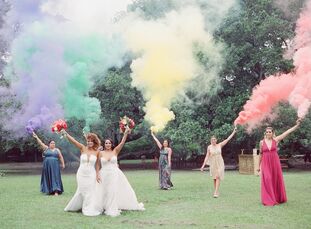 Jazmin and Jessica chose a vibrant rainbow color palette for their wedding the Tree of Life in Audubon Park in New Orleans, Louisiana. "Our love story