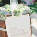 Wanting to give their families and friends something to remember the wedding by, Cara and Scott had custom totes made for their guests. The favor combined personality and practicality and also captured the day’s simple, elegant feel.