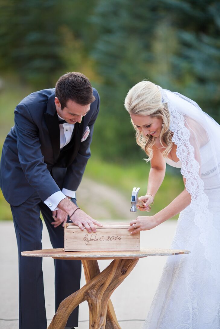 For their unity ceremony, the couple did a wine box tradition. They put a bottle of wine and unopened love letters to each other into the wooden box and nailed each end shut. They will get to decide if they want to open it in one, five or 10 years.