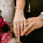 Bride and groom wearing wedding bands