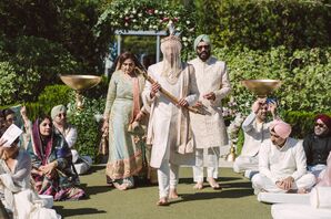 Groom in Sehra Turban and White Sherwani Enter Ceremony With Family