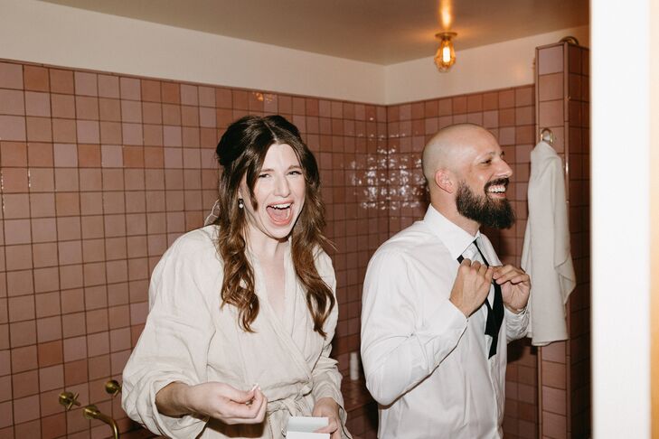 Bride and Groom in Robes Getting Ready for Casual Motel Wedding Together