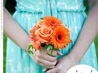 bridesmaid in an aqua dress carrying orange bouquet
