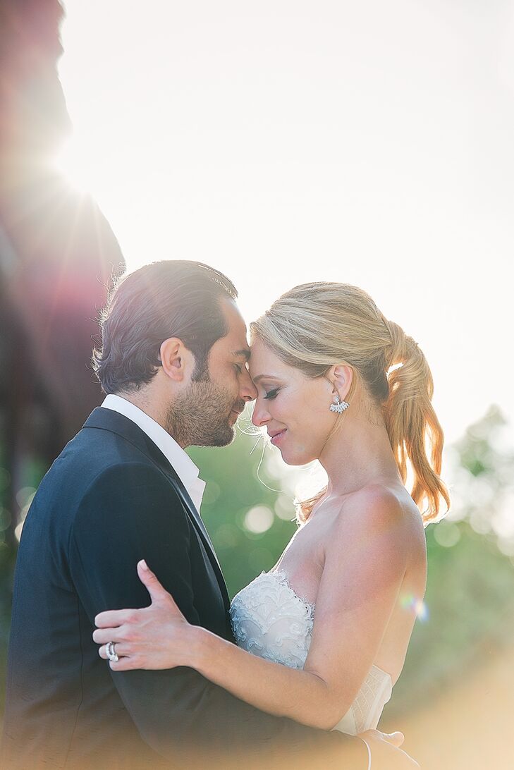 Michelle and Vincent celebrated their families' different cultures by including various traditions in their ceremony, such as the Catholic lasso ceremony and the Jewish breaking of the glass.
