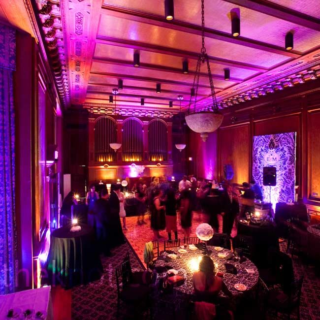 The ballroom was flooded with dramatic red lighting and the staircase was lined with  LED votives.