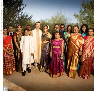 Andrew and Harini's extended family dressed in colorful saris and suits.