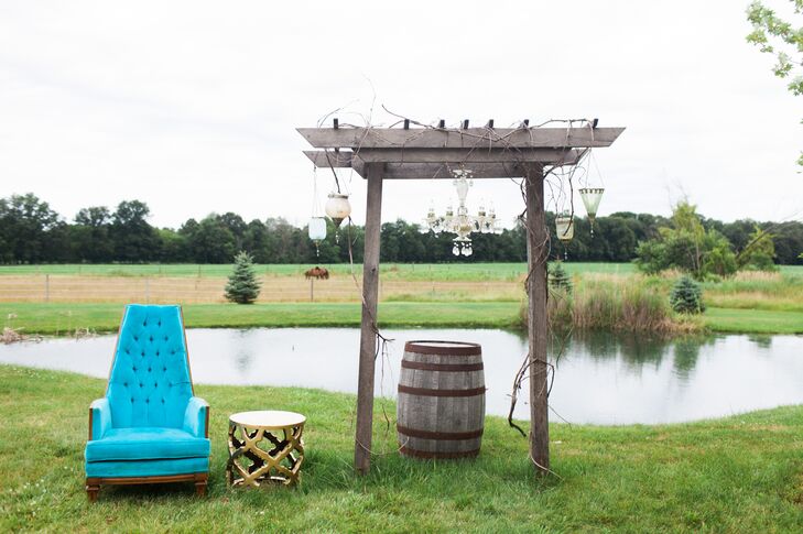 Molly and Visar married under a lantern-laden arch in an outdoor ceremony officiated by Molly’s sister, Abby. “It was something Abby and I had planned since we were young,” Molly says. The couple's pug, Sir Paul, watched from a plush vintage chair as Molly and Vishar exchanged vows.