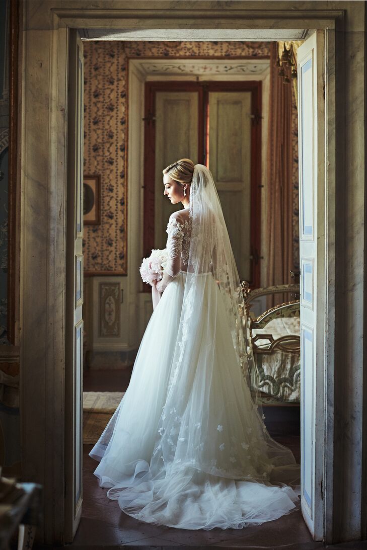 Lace details on Nina's gown carried around to the back, further accented by a beautiful custom veil.