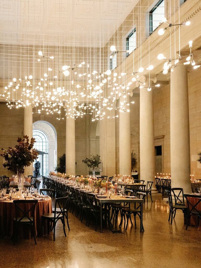 modern wedding reception venue space with lightbulbs hanging from long strings