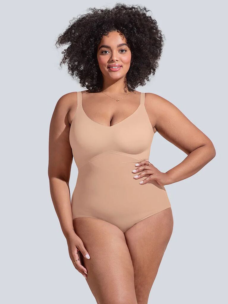 Model wearing nude shaping wedding bodysuit shapewear