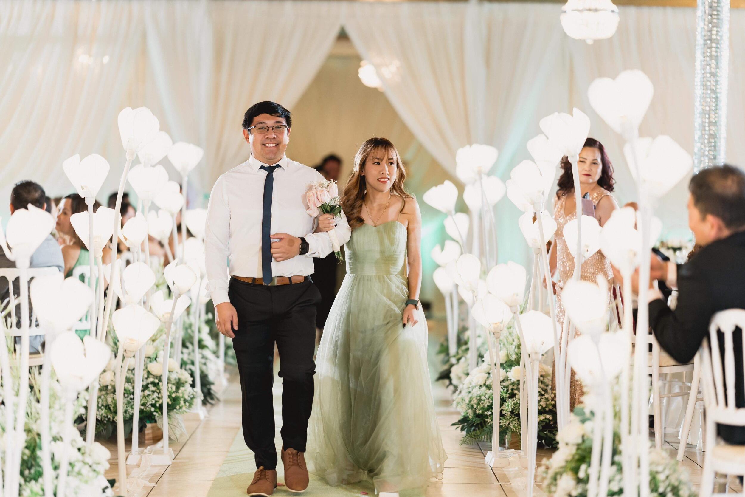 Invited to a wedding by her childhood friend, Trinh was asked last minute to be a bridesmaid and Phong of course was then picked for groomsman. Phong was in the middle of designing Trinh's dream ring, so I guess you could say they were practicing to walk down the aisle.