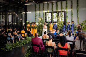 Brides Reading Vows During Intimate, Deep-Colored Ceremony With Tons of Greenery