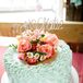 For dessert, Katie and Matt enjoyed a small one-tier cake from Cake Walk in Northfield, Minnesota. They topped the cake with mini white daisies and coral roses for plenty of added romance. Since the cake was small and personal, the couple also served apple and strawberry rhubarb pies.