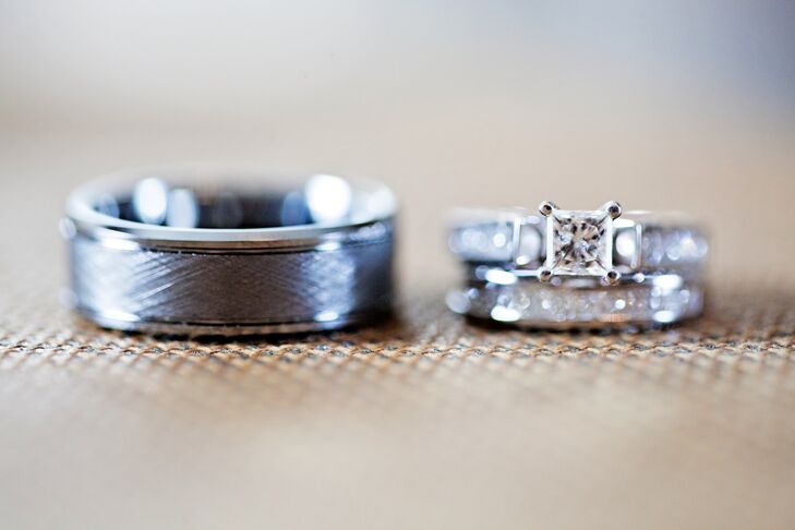 Matt proposed to Chandra with a Tolkowsky engagement ring from Kay Jewelers that has a center princess-diamond complemented with a channel-set of princess and round diamonds.