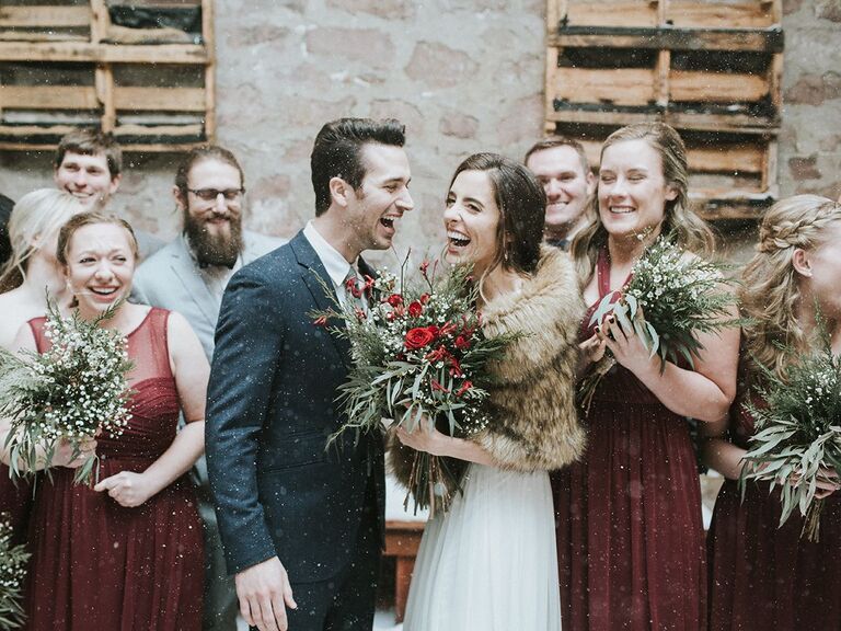 bride and groom with wedding party in burgundy