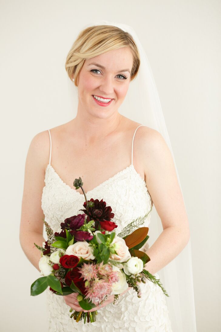 Faith emphasized to her florist, Rosehip Flora, that she wanted her flowers and greenery to feel wintery and lush. Her bouquet completely embodied her vision, with a variety of greens, deep reds, purples, blush and cranberry hues with pops of white to evoke the season.