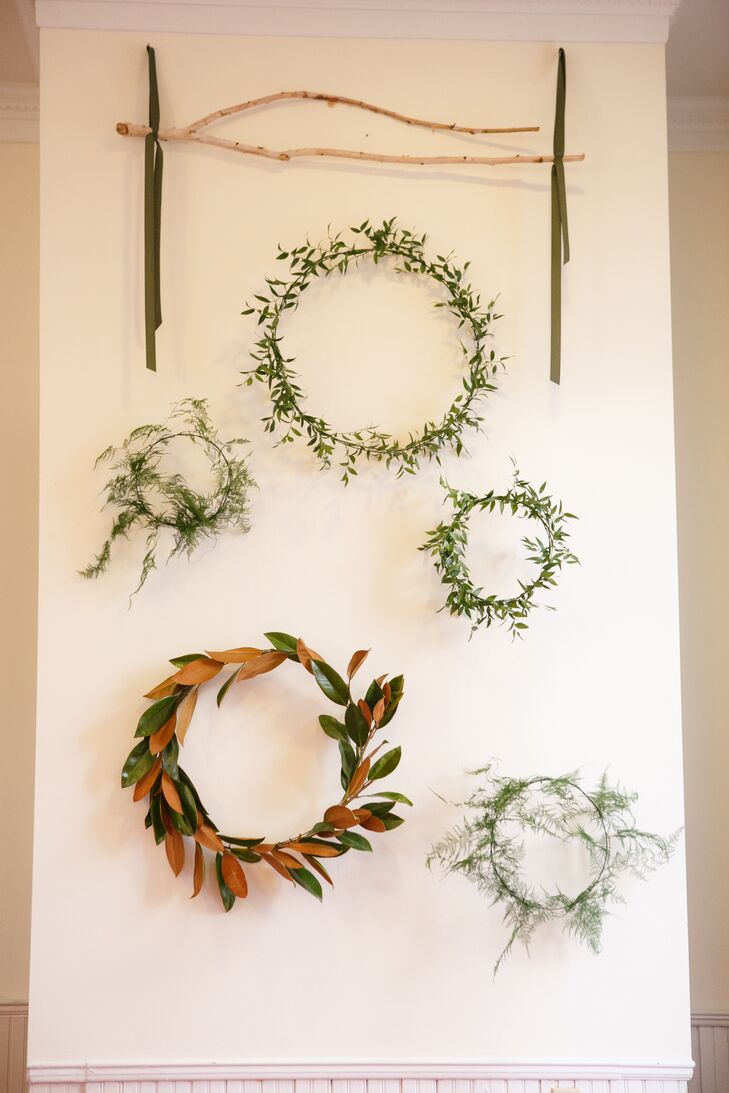For Faith and Jackson's ceremony backdrop, Rosehip Flora created organic wreaths of winter greenery to evoke the season without detracting from the classic beauty of Hyde Park Presbyterian Church. A garland of olive branches decorated the chapel entrance.