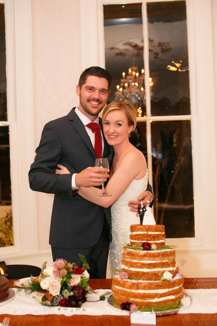 Faith and Jackson's cake embodied their style: It had a classic bride and groom cake topper, but the rustic naked cake style decorated with winter greenery and flowers conveyed their personal tastes.