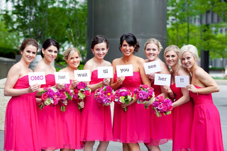 Teresa's bridesmaids wore matching "azalea" pink short strapless dresses by Love Lane that paired perfectly with their bright pink ranunculus bouquets. Teresa gave them custom earrings and bracelets from Erin Gallagher Jewelry and monogrammed necklaces from Mark and Graham. They wrote out a special message, which they photographed and texted to the groom to tease him in anticipation of seeing the bride.