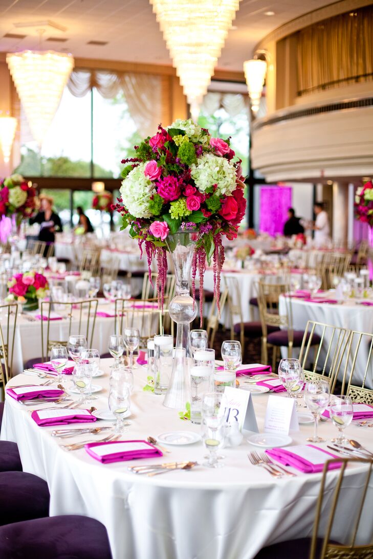 Teresa and Ryan had both tall and short centerpieces with bright pink and green arrangements of roses and hydrangeas, as well as some orchids, ranunculus, tulips, and calla lilies. Bright pink napkins added a pop of color to the white linens. In lieu of favors, cards indicated donations made to the American Liver Foundation and the Make-A-Wish Foundation of Illinois.