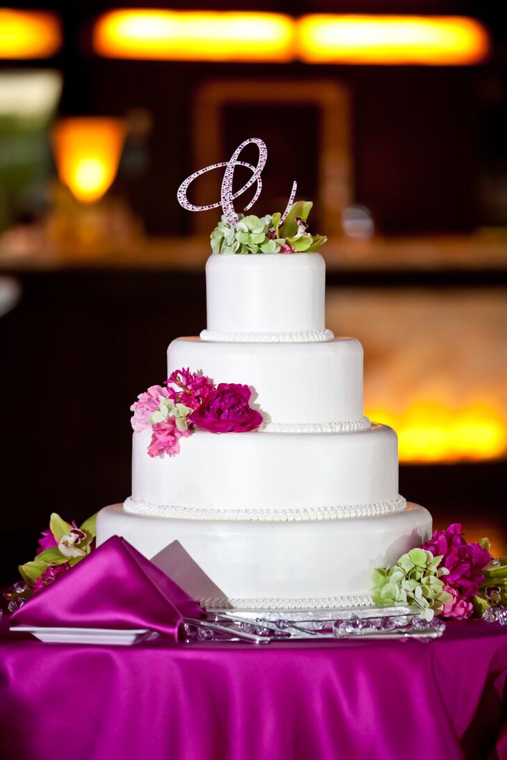 Four-Tier Shimmery White Wedding Cake with Pink Monogram Cake Topper