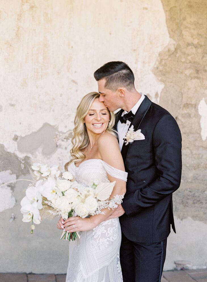 Couple Shares Embrace During Wedding Portraits at Franciscan Gardens in San Juan Capistrano, California