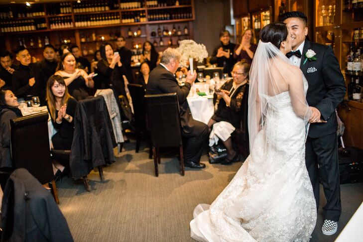 After Kathy and Jon had their first dance, they played a slide show of pictures of their favorite times together. At the end was a special pregnancy announcement that took all of their guests by surprise.