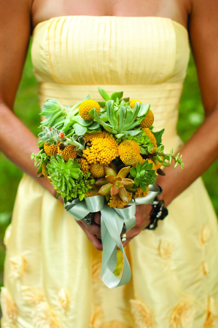 Yellow and green bouquets of succulents and craspedia matched the girls' dresses.