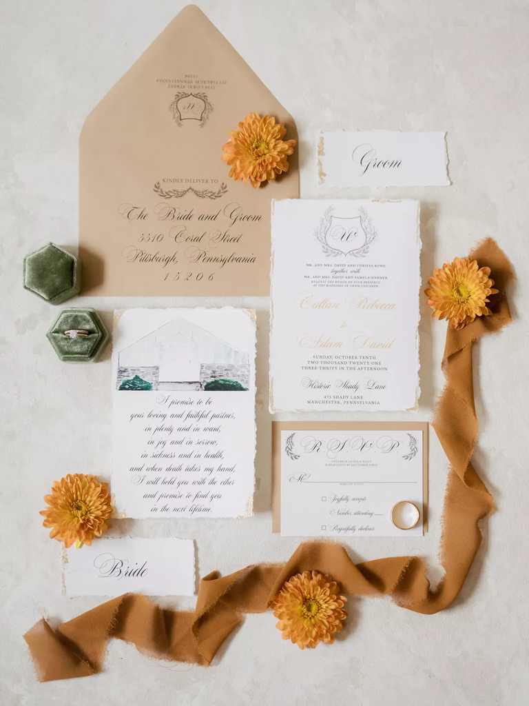 A breathtaking autumn-inspired stationery suite in muted gold and orange tones.