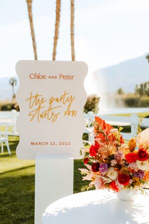 Stylized Acrylic Reception Sign With Retro Vibes in Warm Colors at Desert Wedding
