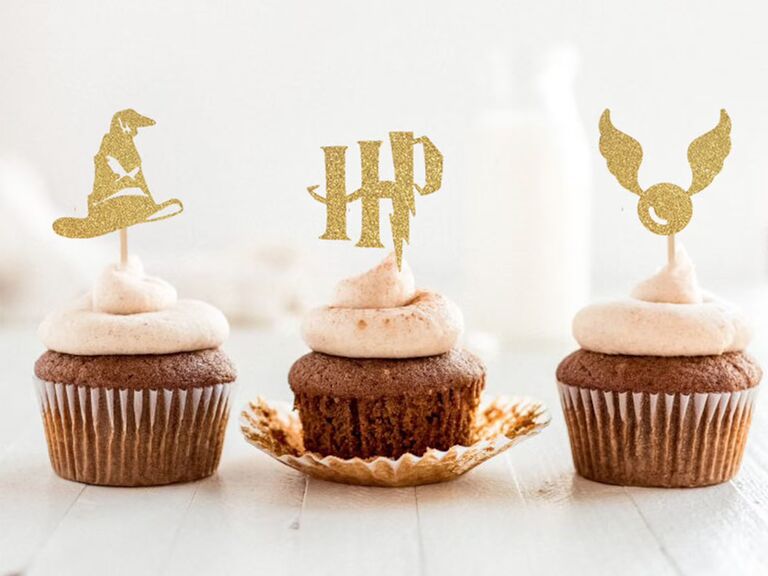 Gold glittery cupcake toppers of sorting hat, HP and snitch