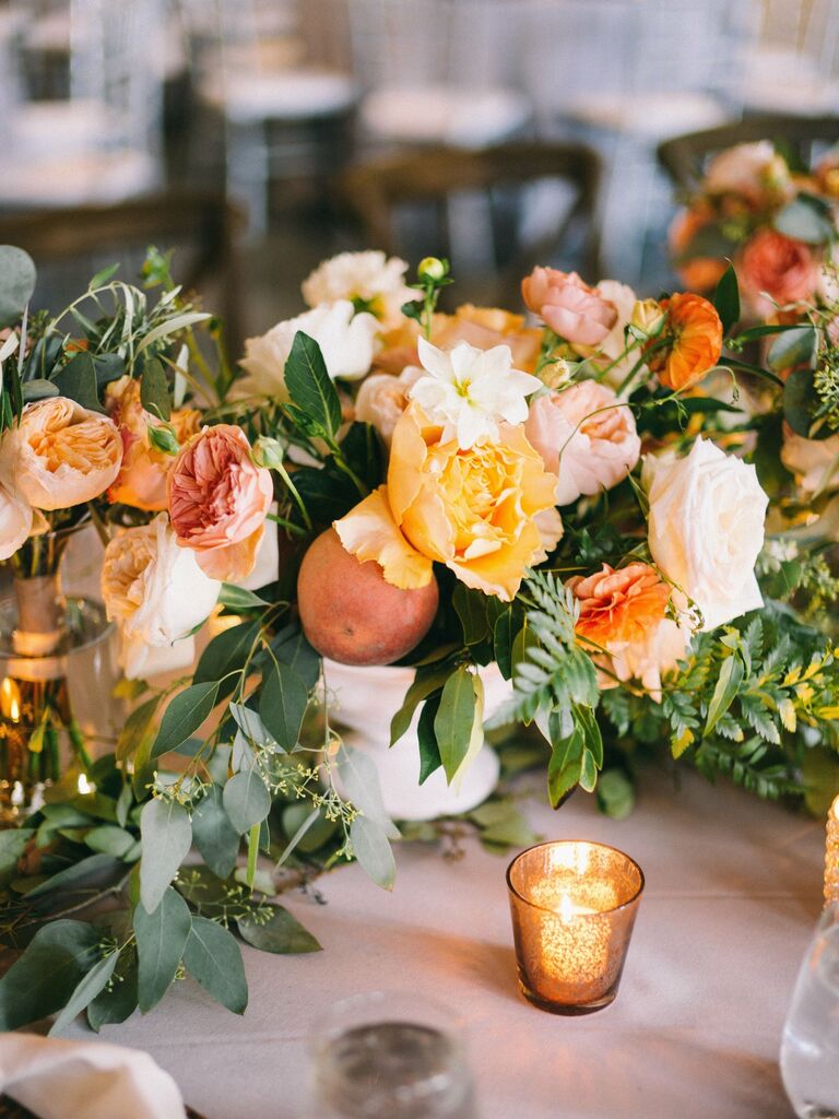 Peonies peaches wedding table arrangements fruit