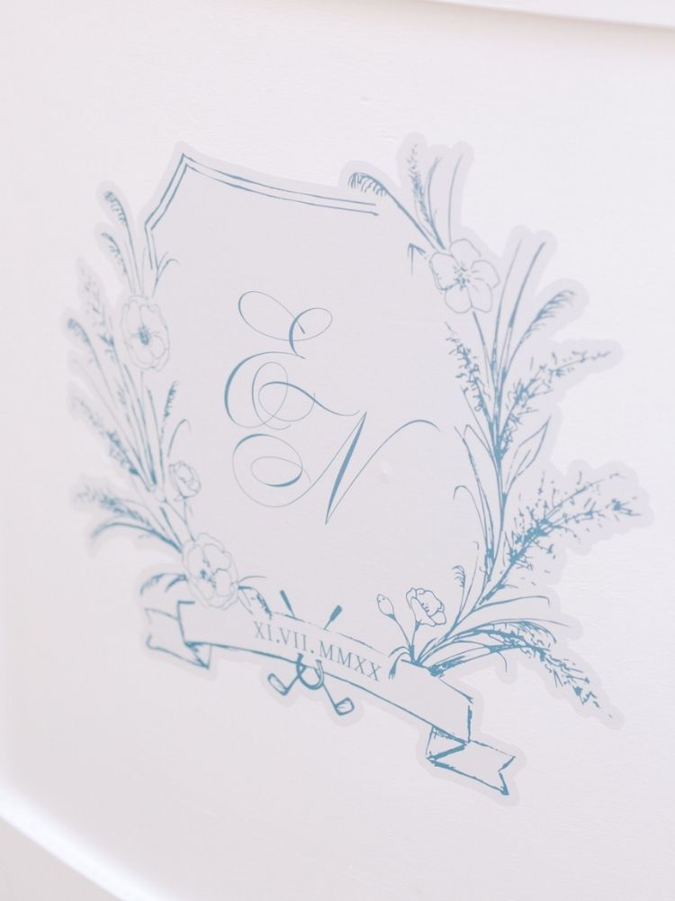 blue-and-white monogram sign