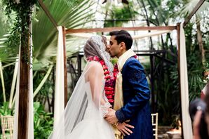Couple with Flower Garlands Under a Wood Mandap