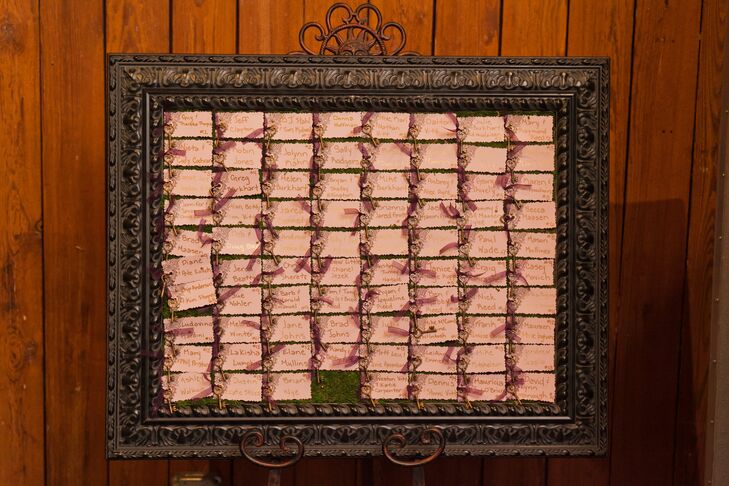 In keeping with the secret garden theme, Kristen tied a small antique key with a plum ribbon to all of the blush-colored escort cards.