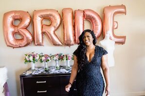 Bride in Black Wedding Dress Posing in Front of Balloons