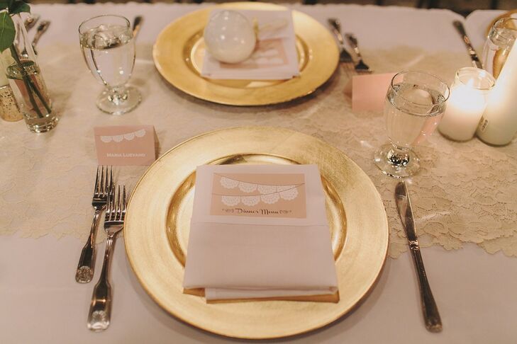Guests' place settings had gold chargers, and neutral paper goods including menu cards and place cards, topped with the papel picado theme.