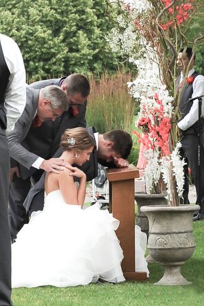 Bride and Groom Praying at Christian Ceremony