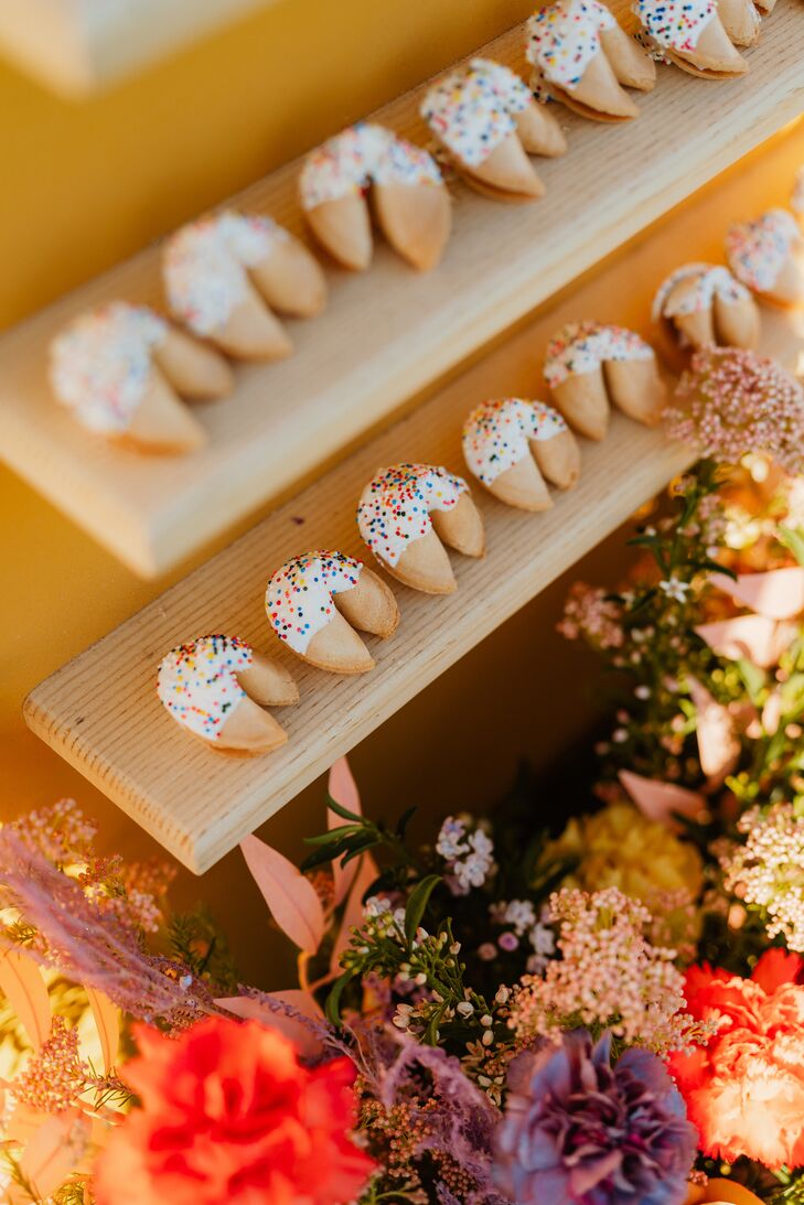 Fortune Cookies Dipped in Frosting and Sprinkles on Bright Escort Display