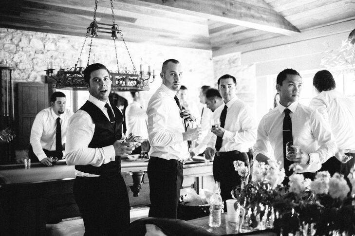 Brittany and Justin designed their entire wedding around a timeless, classic look so Justin wore a fitted black Hugo Boss Tuxedo. His groomsmen matched in equally classy black Jos A Banks tuxedos.