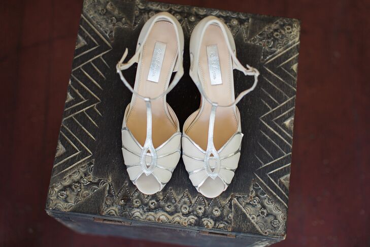 Keeping their simplistic vintage theme in mind,  Alex paired her white illusion neckline Elizabeth Dye  wedding dress with a fun pair of ivory and silver peep-toe t-strap BHLDN wedding shoes.
