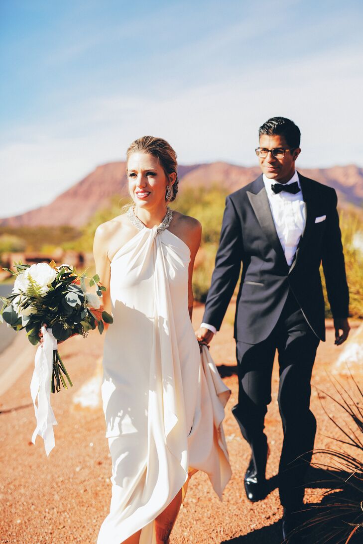 The bride wore a custom Neiman Marcus wedding gown at the reception; the groom wore a blue tuxedo created by Enzo Custom in Washington, DC.