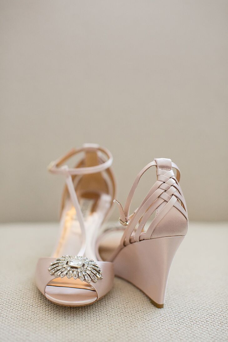 Mary wore blush Badgley Mischka wedges with jewel and braid detailing. "Wedding wedges? Who even knew that was a thing. I saw them online, and they were the exact color of the bridesmaid dresses. I was able to dance the whole night without going barefoot."