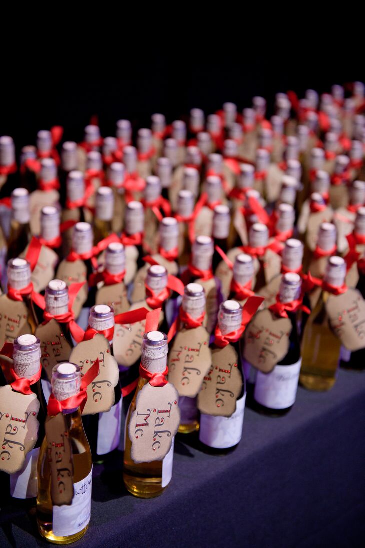 As favors, Nicole and Daniel gave their guests bottles of red and white wine that were made and bottled by Nicole's father. The bottles had tags that read "Take me," to go with the 'Alice in Wonderland' theme.