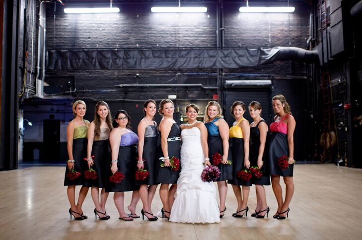 Nicole's bridesmaids wore black dresses with different-colored bodices by Alfred Angelo. "I love how they matched and complemented one another," Nicole says.