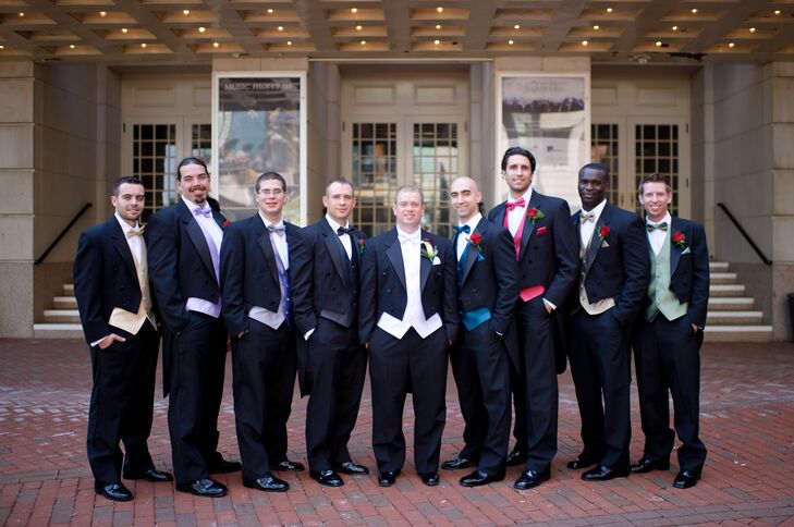 The groomsmen wore black tuxedos with different-colored vests and bow ties. Daniel wore a white vest and bow tie with his tuxedo.