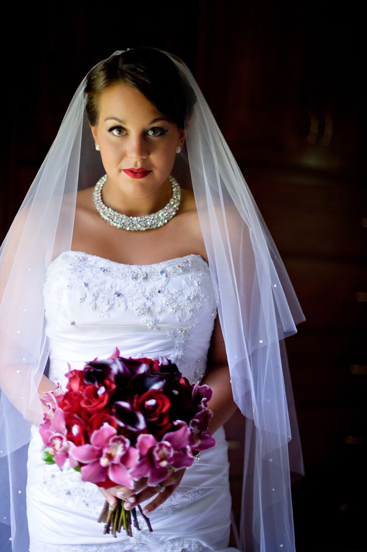Nicole wore a Watters wedding dress, which she bought from Julie Allen Bridal in Newtown, Connecticut. She had the dress embellished with Swarovski crystals. She also wore a fingertip veil and Swarovski crystal jewelry.