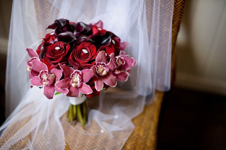 Nicole carried a bouquet with pink orchids, red roses and deep purple calla lilies on her wedding day.